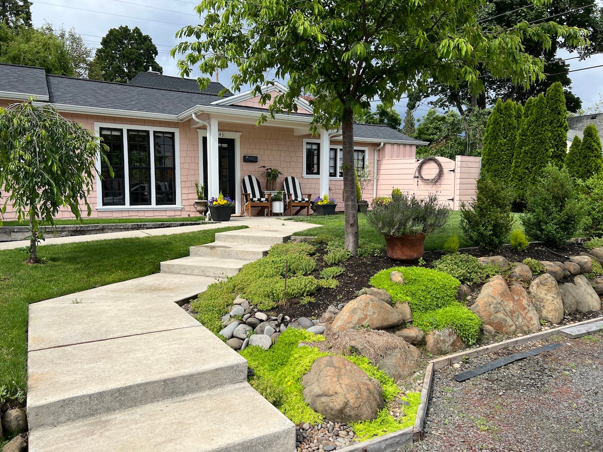 Little Pearl, a rose-pink bungalow with white trim in Eugene's Market District